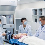 Varian VitalBeam linear accelerator in use with clinicians at the hospital