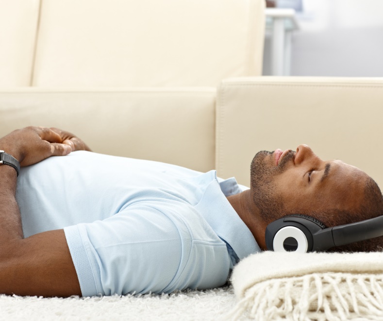 A person resting in stillness — the body softening as stored tension releases