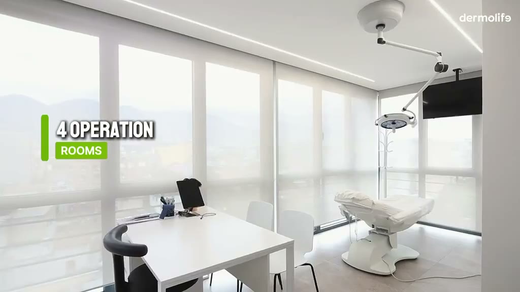 A hair transplant operating room at the Trita hair clinic, with a treatment chair and surgical light