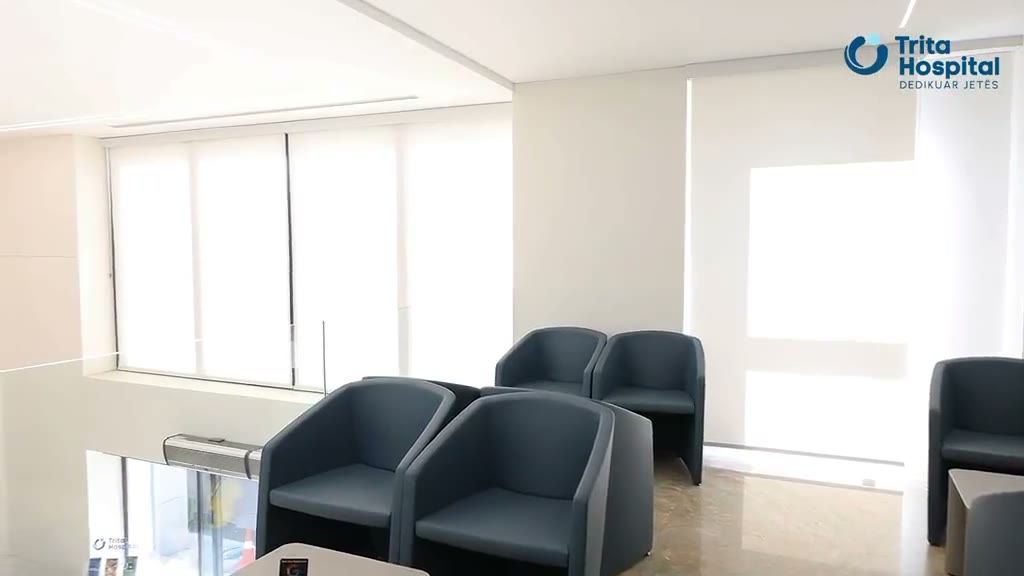 A bright waiting area at Trita Hospital with armchairs and floor-to-ceiling windows